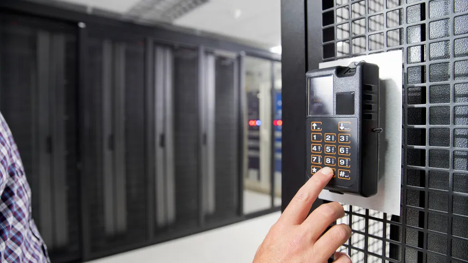 Illustrative photo: Hand entering a code on an access keypad.