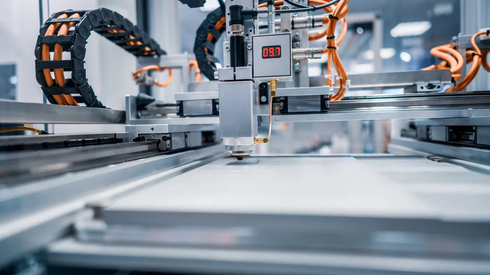 Illustrative photo: Automated machinery working on a factory production line.