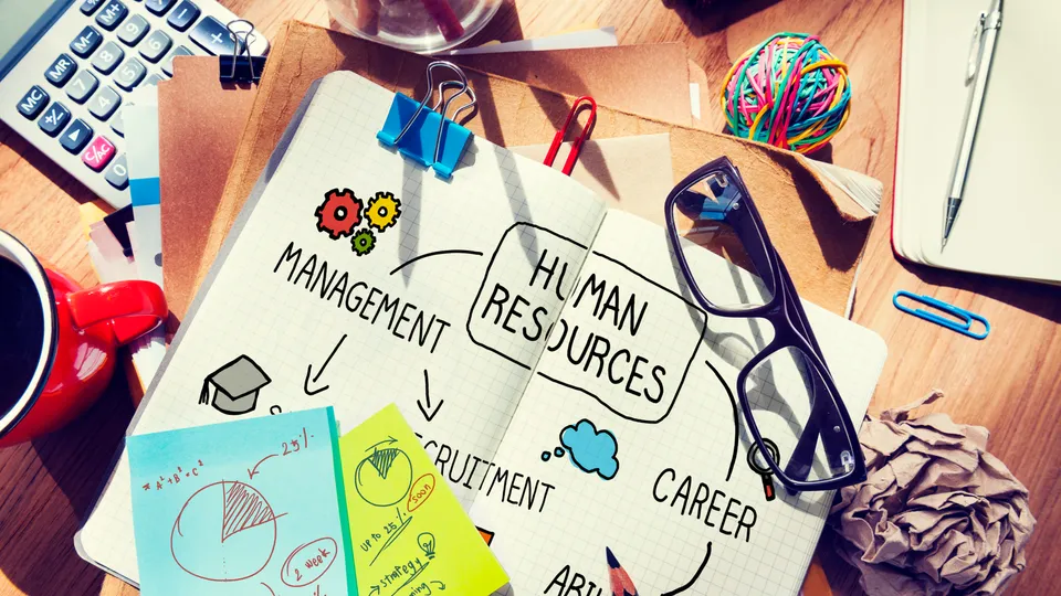 Illustrative photo: Notebook with human resources and career planning notes on a desk.