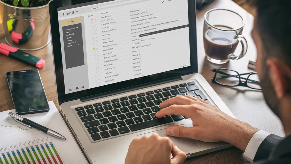 Illustrative photo: Person reading email on a laptop.
