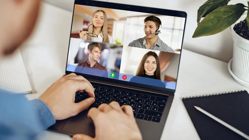 Illustrative photo: Person attending a group video call on a laptop.
